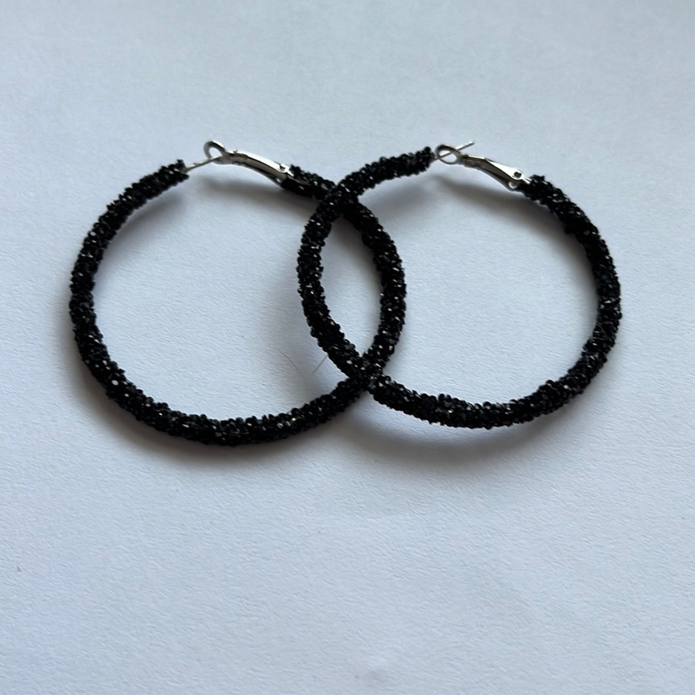 Black sparkly hoop earrings